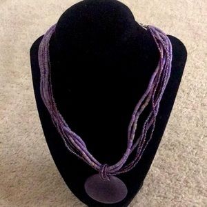 Multi Strand Purple Necklace with Circular Pendant